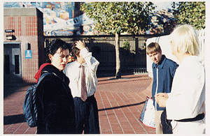 On rollover, text on the image says, 'Huck, Brian, Arianna, and Bonemaker waiting to be cable cast live during the filming of episode 6. This now famous photo was taken moments before Bonemaker was brutally assassinated'.