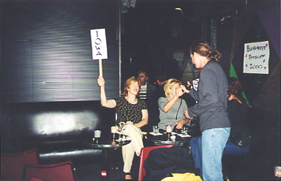 Delegates from Iowa hold up their signs
