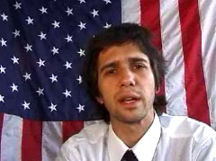 pic of Ronald Bonemaker in front of the Cubby flag